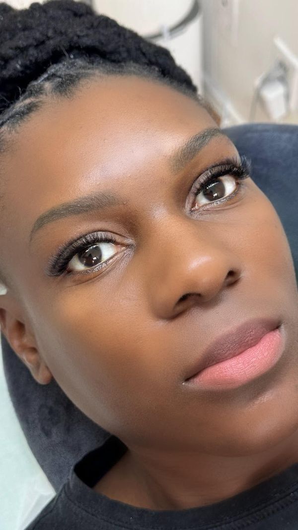 Natural-looking eyelash extensions on brown eyes